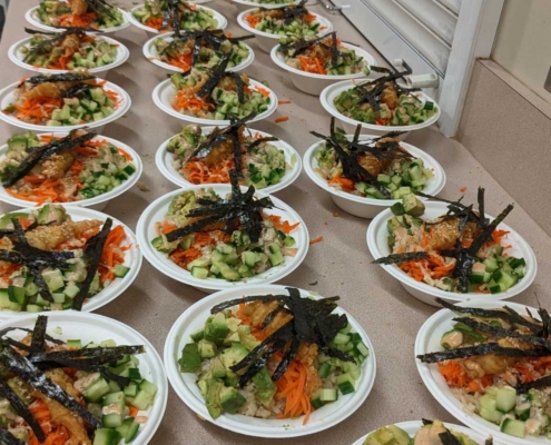 multiple plates of vegetables on a table