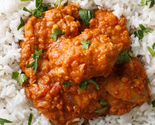 curry on top of a bowl of rice